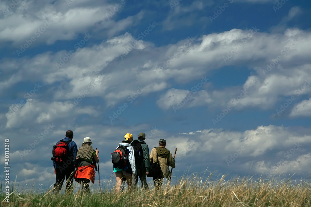 Hikers are walking on the sky background