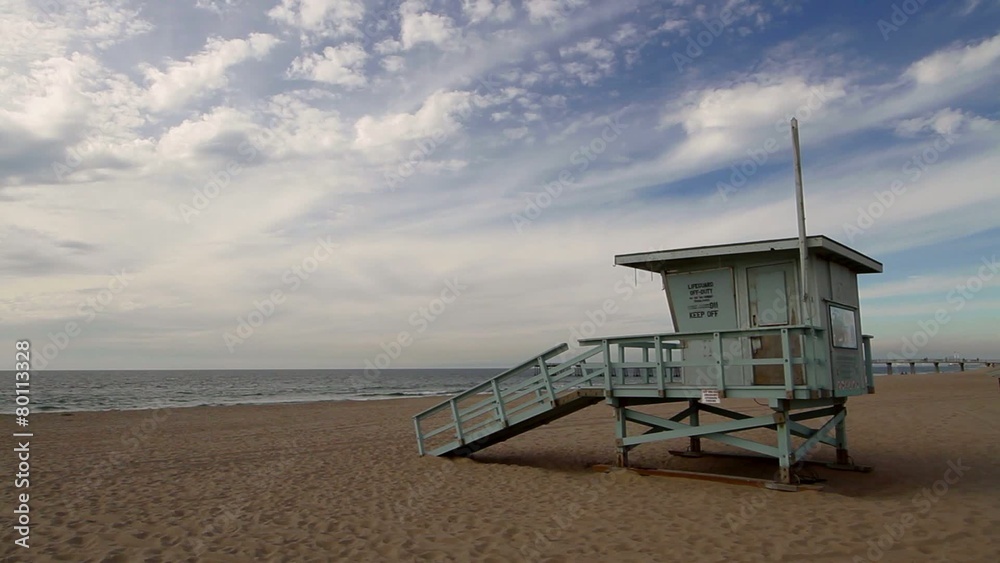 Empty beach with a lifeguard hut with beautiful sky in California, USA.