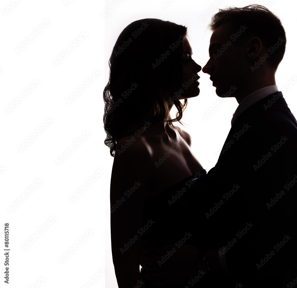 silhouette vlublennoj happy couple kissing on a white background