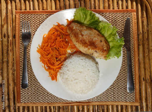 Chicken escalope with steamed rice and carrot salad photo