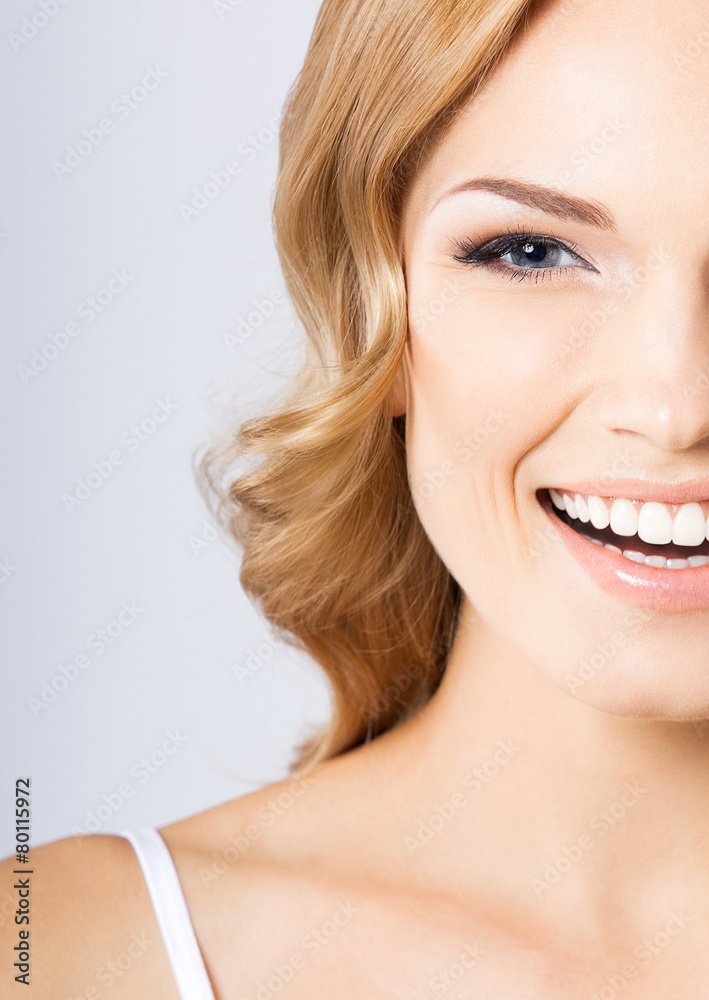 Happy smiling woman, over grey Happy smiling woman, over grey