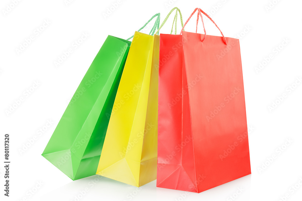 Red, yellow, green shopping bags on white, clipping path