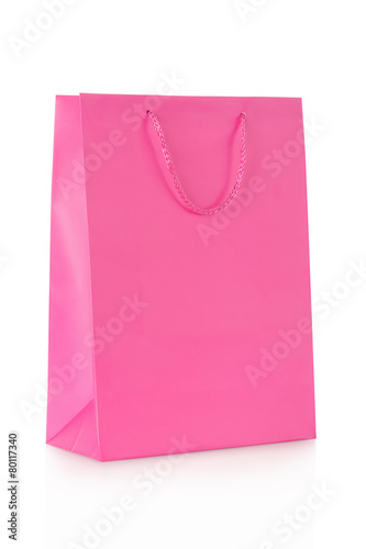 Pink shopping bag in paper on white, clipping path