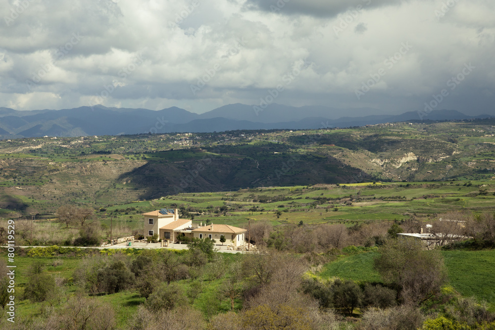 Stormy Mediterranean landscape with mountains, clouds, trees and Stormy Mediterranean landscape with mountains, clouds, trees and