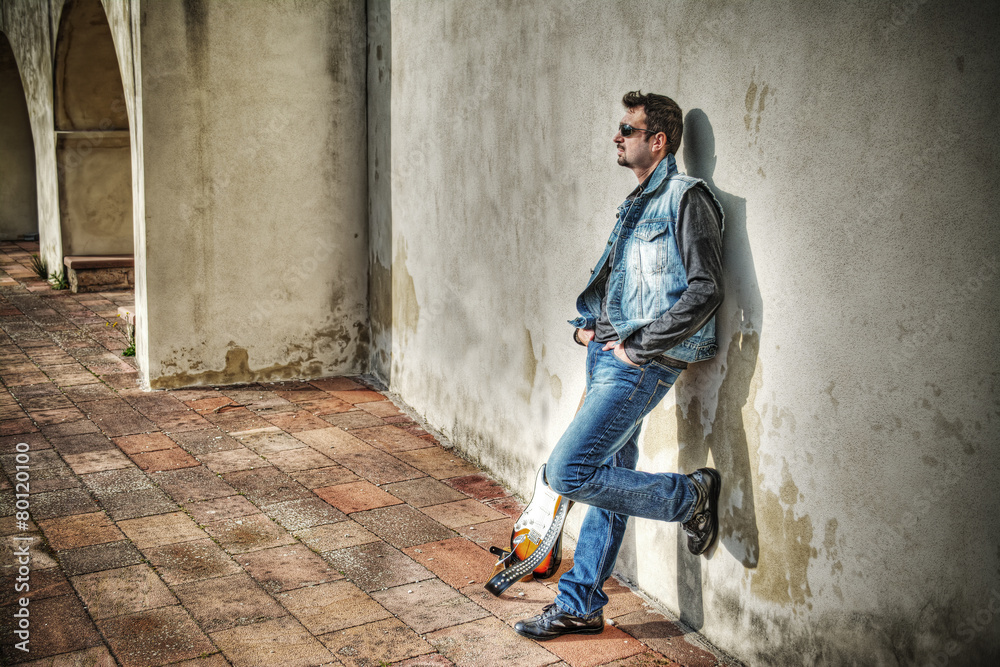 man and electric guitar in hdr