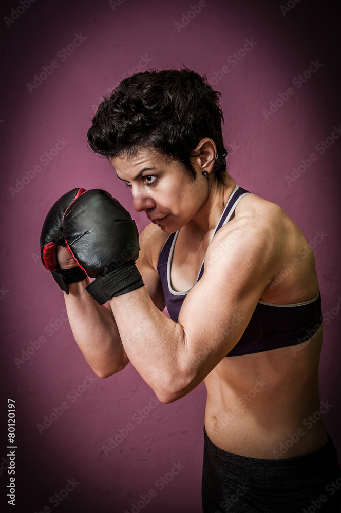 Female boxer training in a gym