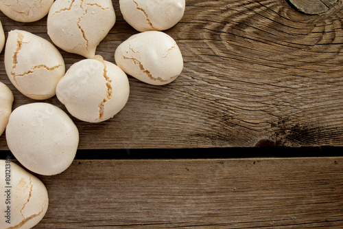 Meringues on wooden table