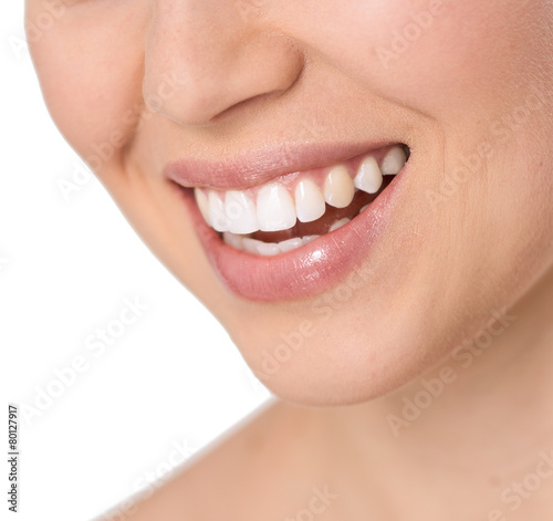 Close-up of beautiful healthy woman's smile with white teeth