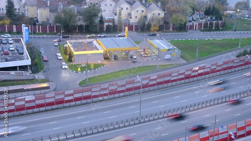 Day city: zoom on gas station near bridge, Moscow, Russia. Timelapse photo