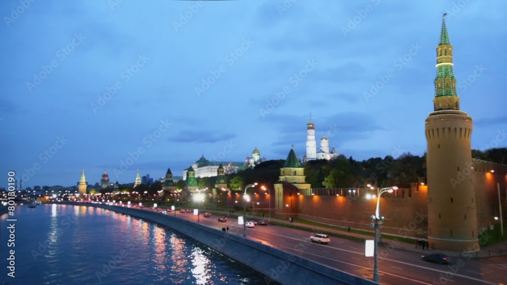 Ship sail by river with traffic on quay near Kremlin wall at evening Ship sail by river with traffic on quay near Kremlin wall at evening