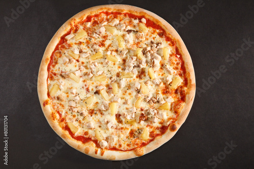 Tasty Italian pizza with pineapple chicken and cheese