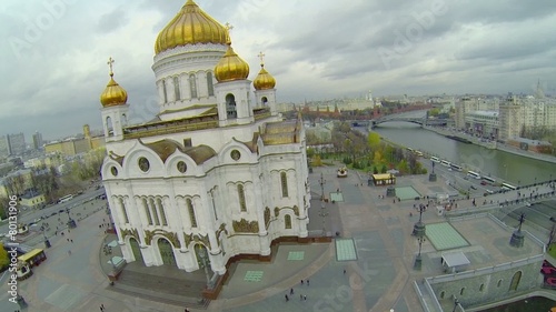 Tourists walk near Christ the Saviour Cathedral 