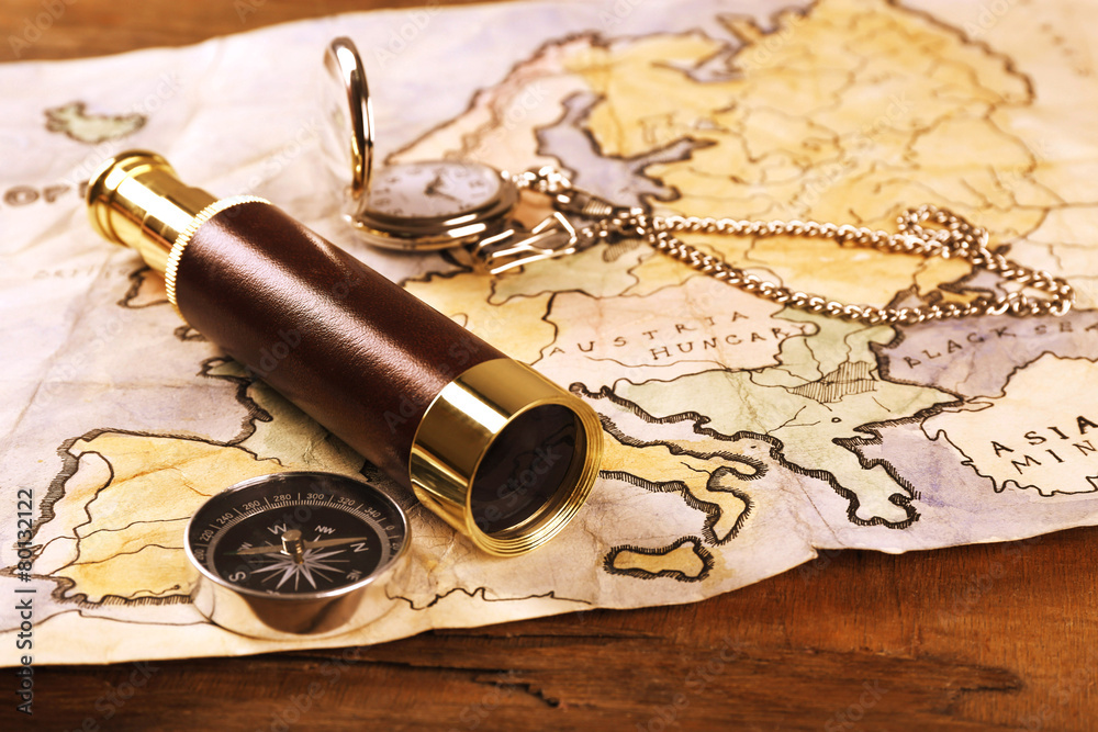 Marine still life with world map and spyglass