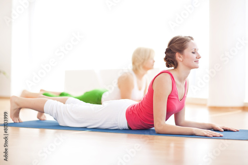 Two yogas woman indoors