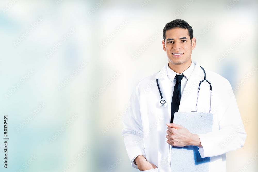 happy confident medical doctor standing in hospital hallway happy confident medical doctor standing in hospital hallway