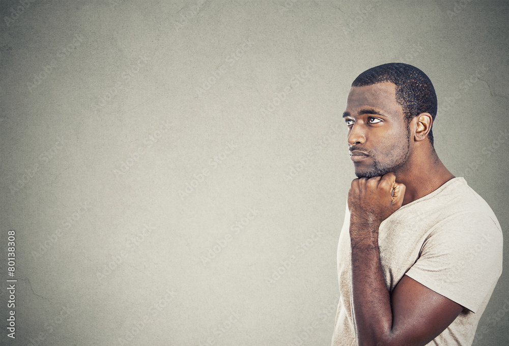 sad, depressed, worried young man looking up sad, depressed, worried young man looking up