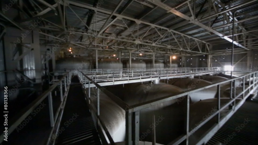 Dark department with big cisterns for beer in Ochakovo factory Dark department with big cisterns for beer in Ochakovo factory