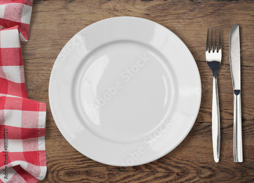 dinner table with dinning plate, fork and knife top view