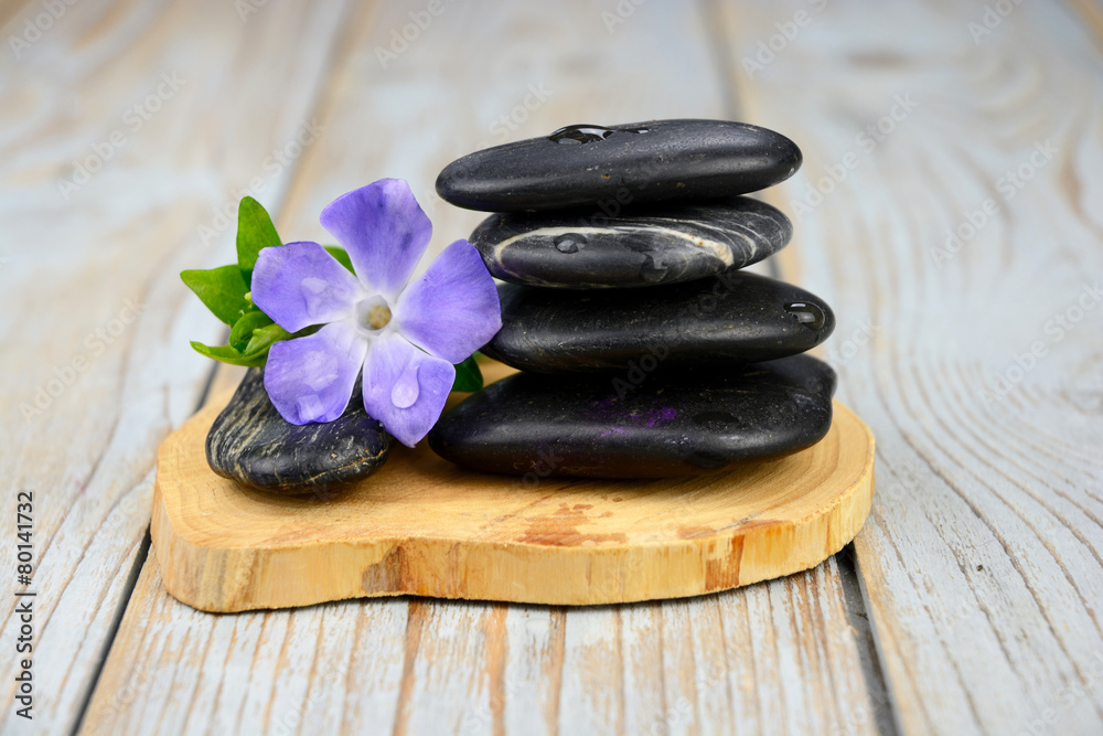 Black warmth zen stones decoration on old wooden background Black warmth zen stones decoration on old wooden background