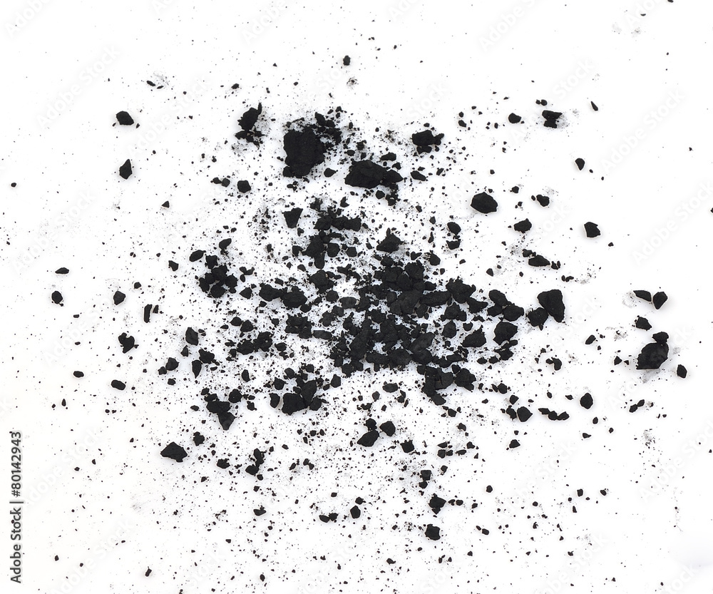 particles of charcoal on a white background