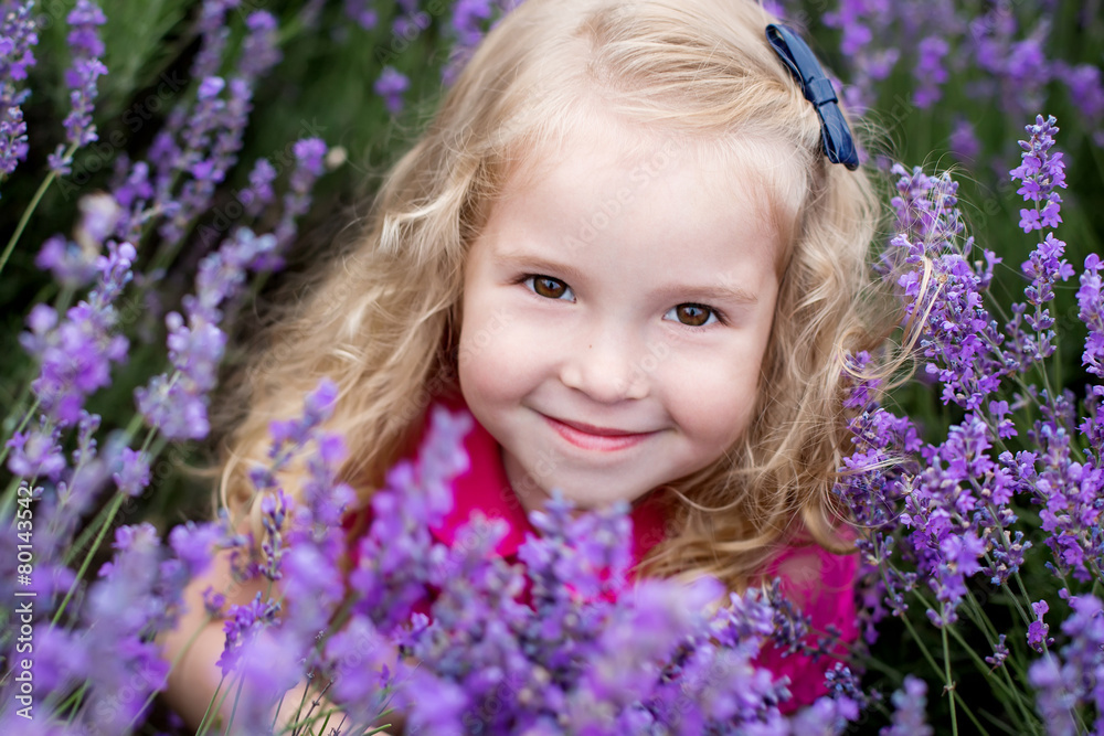 portrait smiling toddler girl in lavender portrait smiling toddler girl in lavender