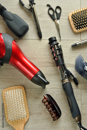 Obraz na plátně hairdressing tools on a wooden floor