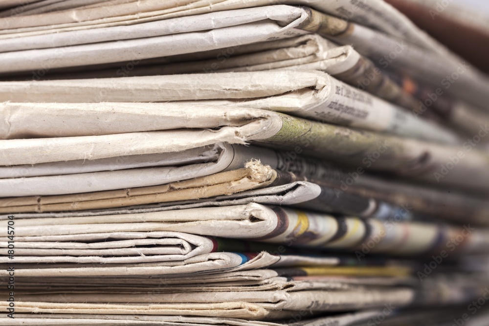 Newspaper. Pile of newspapers Newspaper. Pile of newspapers