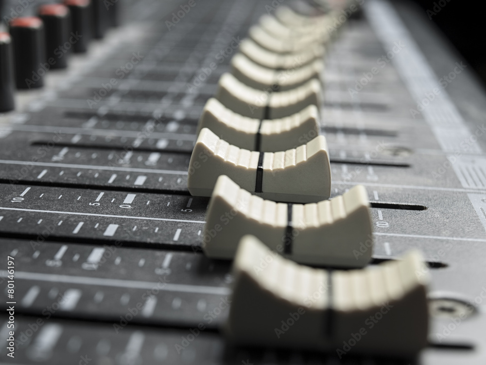 Faders on the mixing desk