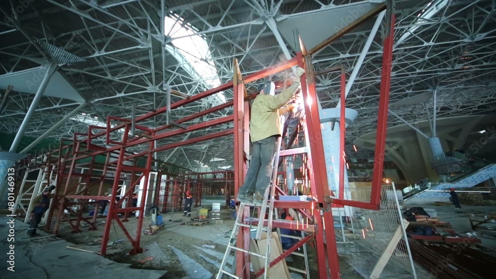 Group welders working at construction of new terminal in Vnukovo Group welders working at construction of new terminal in Vnukovo