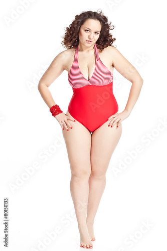 Beautiful woman in red swimsuit in studio