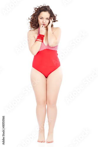 Beautiful woman in red swimsuit in studio