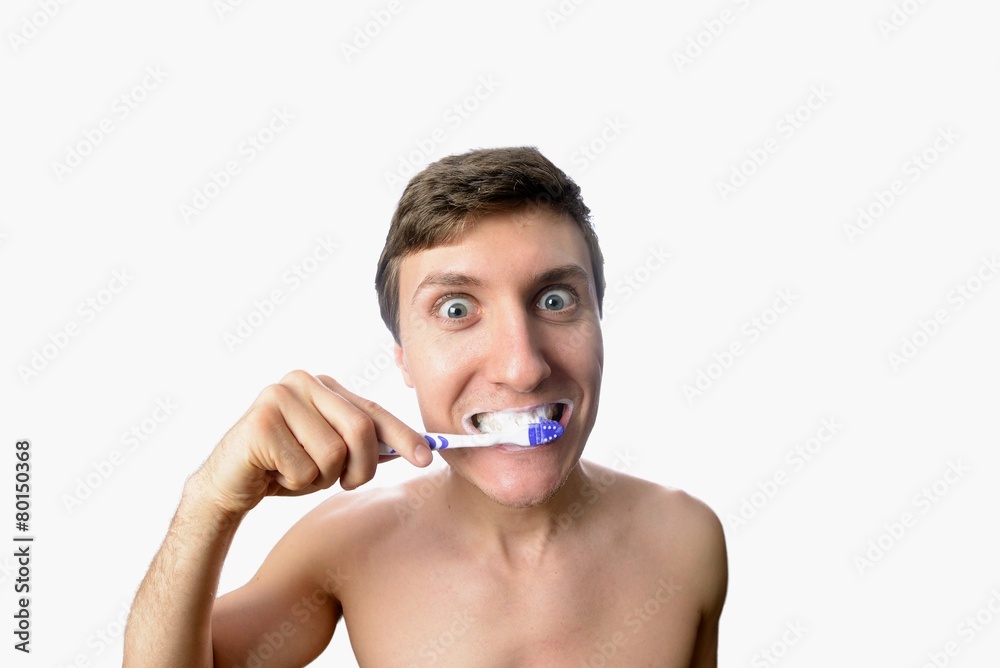Funny man furiously brushing his teeth on white background Funny man furiously brushing his teeth on white background