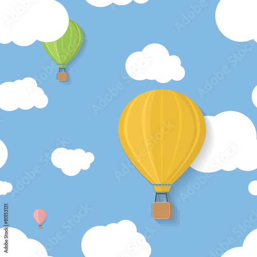 Three coloured aerostats in blue skies with clouds seamless