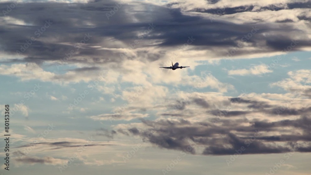 Silhouette of aircraft which flies in sky among clouds Silhouette of aircraft which flies in sky among clouds