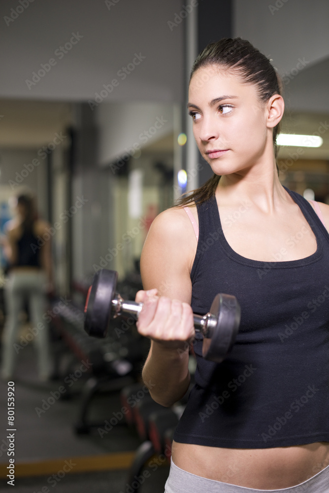 Woman training biceps Woman training biceps