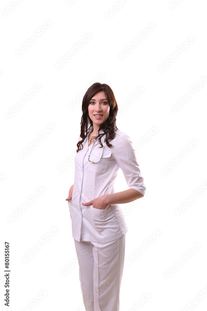 A female doctor with hands in pockets lasts, standing isolated o A female doctor with hands in pockets lasts, standing isolated o