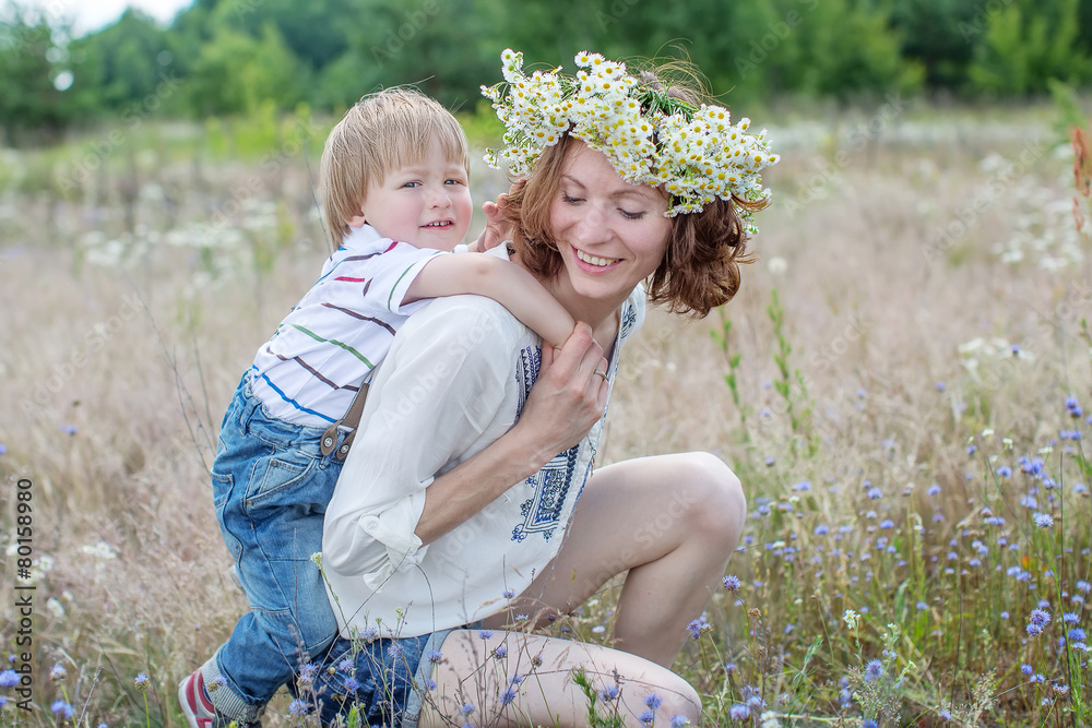 Fototapeta premium Caucasian baby boy take rest in summer park