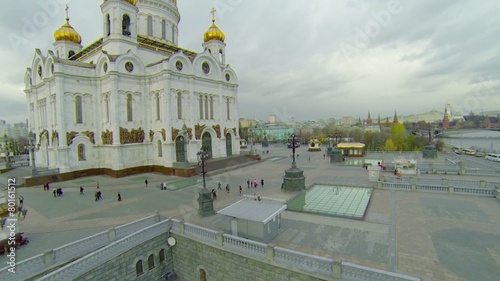 Tourists walk near Christ the Saviour Cathedral