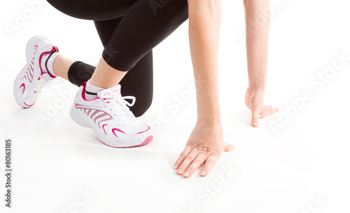 Fitness. Feet of jogging person on white background