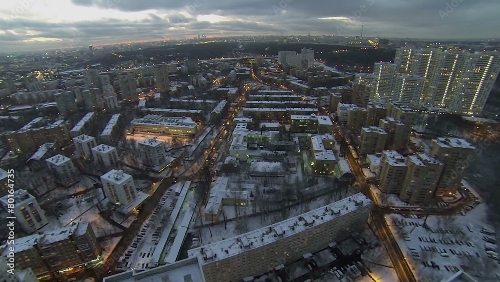 Street traffic at winter evening in snowbound megalopolis Street traffic at winter evening in snowbound megalopolis