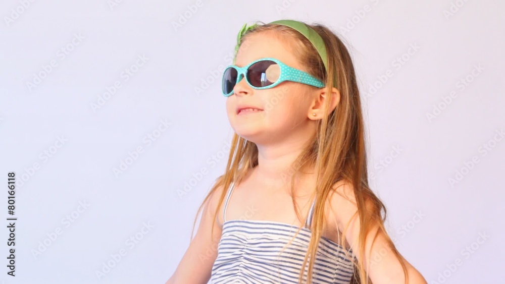 girl in striped dress green rim and spotty spectacles close up girl in striped dress green rim and spotty spectacles close up