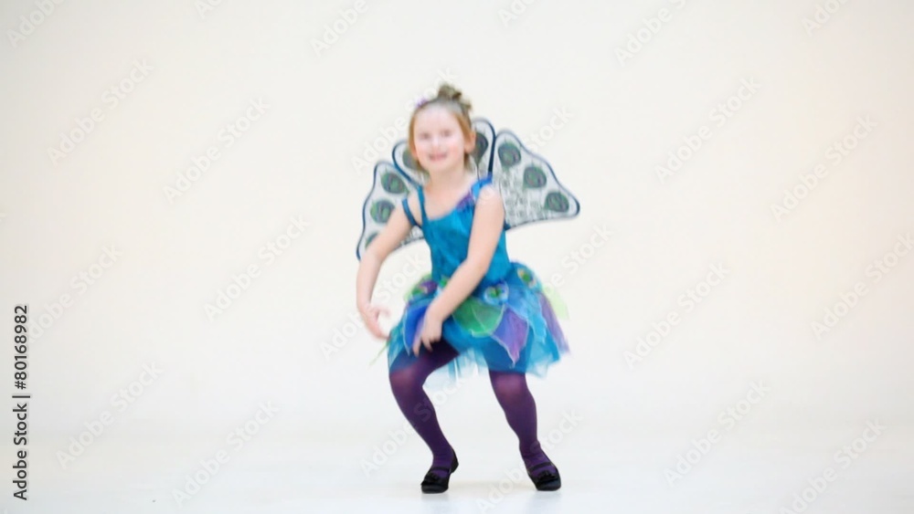 Little girl in peacock costume talking and moving isolated Little girl in peacock costume talking and moving isolated