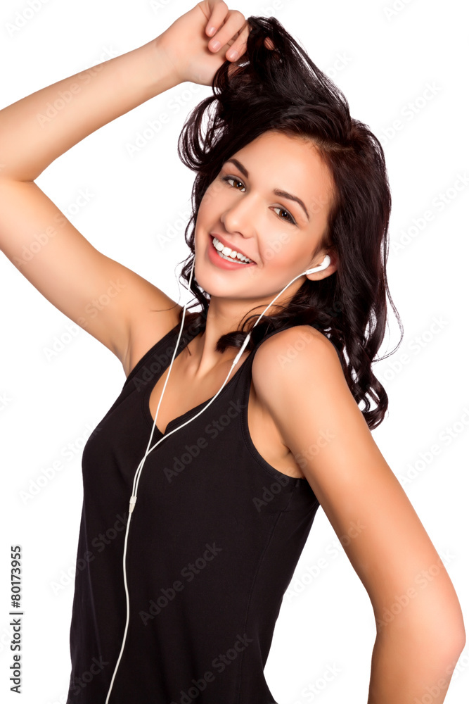 Fototapeta premium Young Beautiful Brunette Woman Listening Music and Entertaining