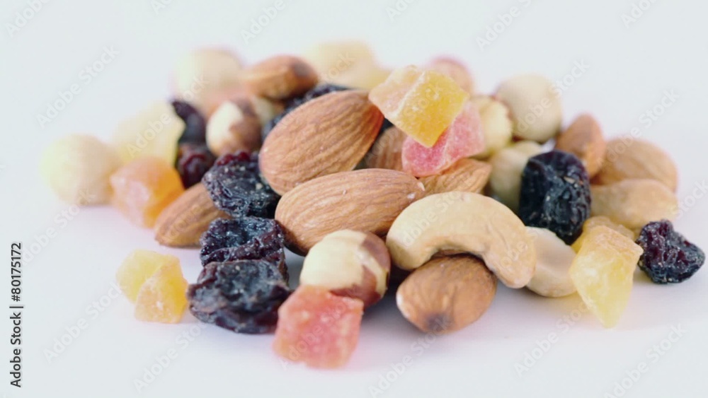 Handful of nuts, dried fruits and candied fruits circling Handful of nuts, dried fruits and candied fruits circling