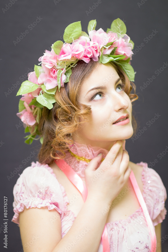 Young woman in image of spring looking up.