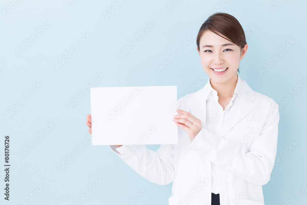 young asian doctor on blue background young asian doctor on blue background