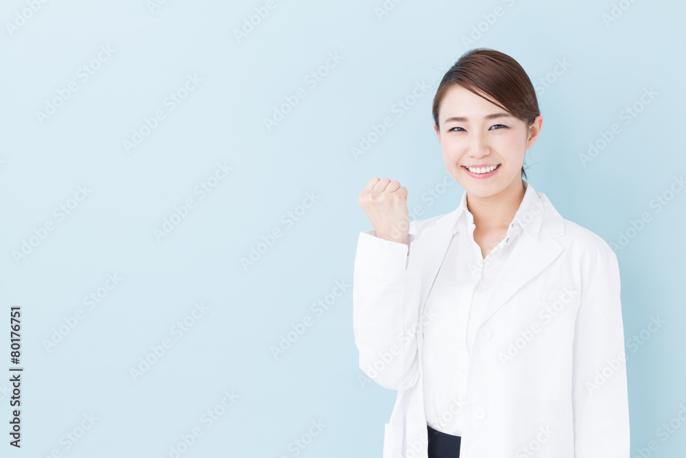 young asian doctor on blue background young asian doctor on blue background