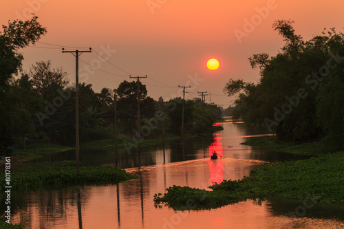 Sunset over the canal in rural of thailand photo