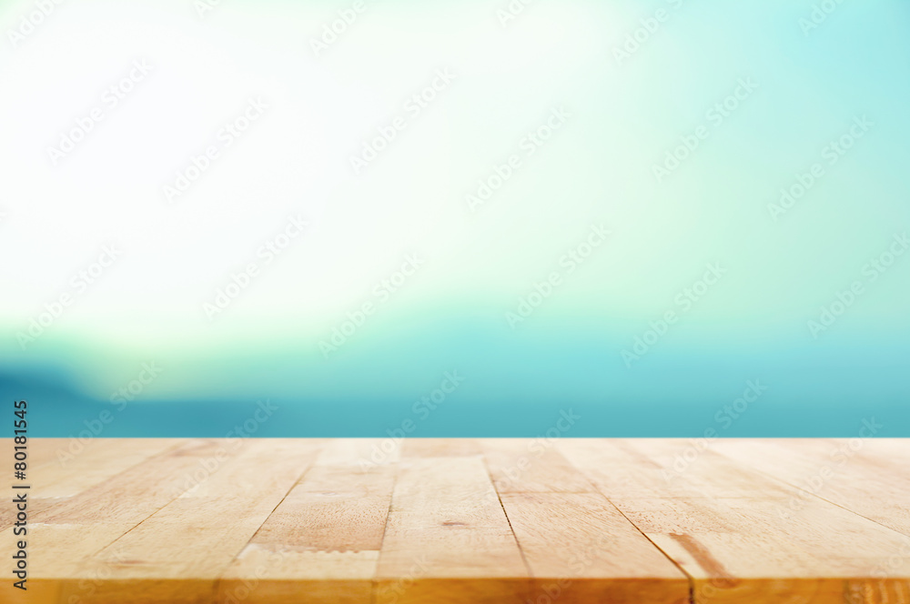 Wood table top on white blue gradient background Wood table top on white blue gradient background