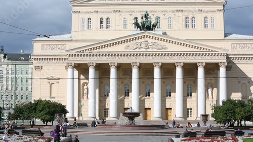 Building of Bolshoi Theatre and people around fountain 